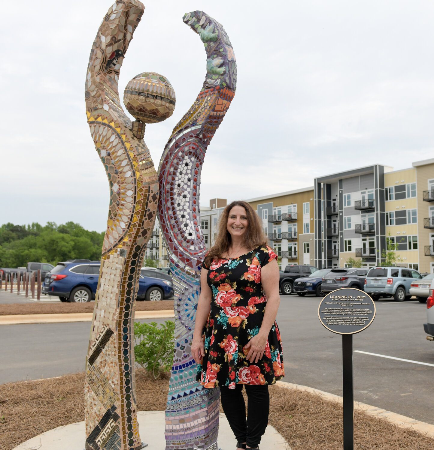 Theresa Arico, well known artist and sculptur of N.C., crafted the new interactive sculpture 'Leaning In,'  that can be found in front of The Guild.